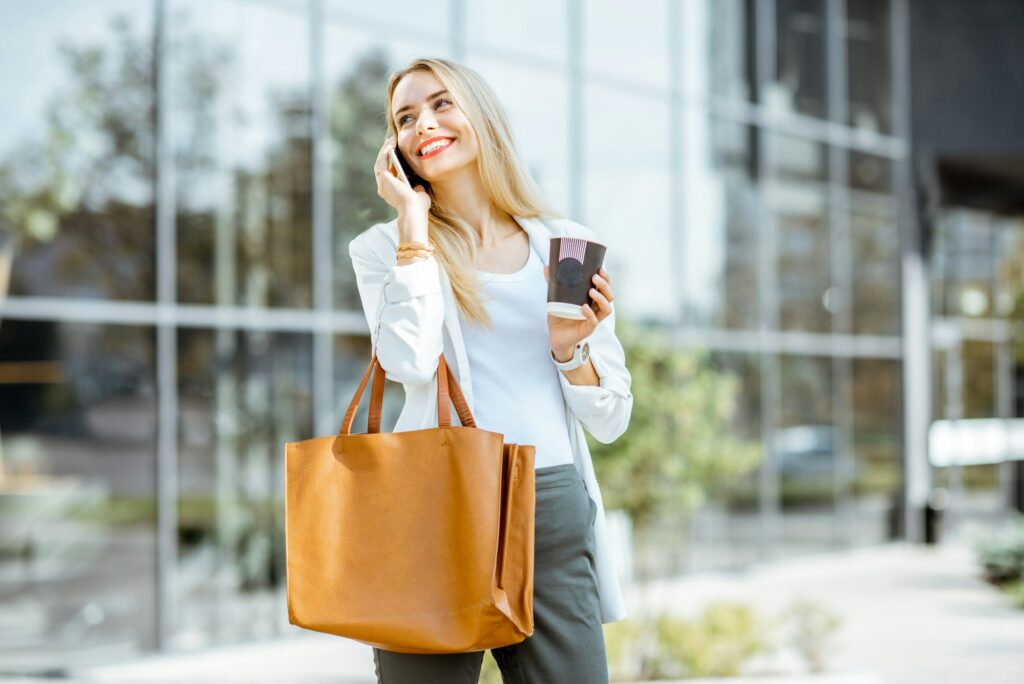 Businesswoman talking phone outdooors