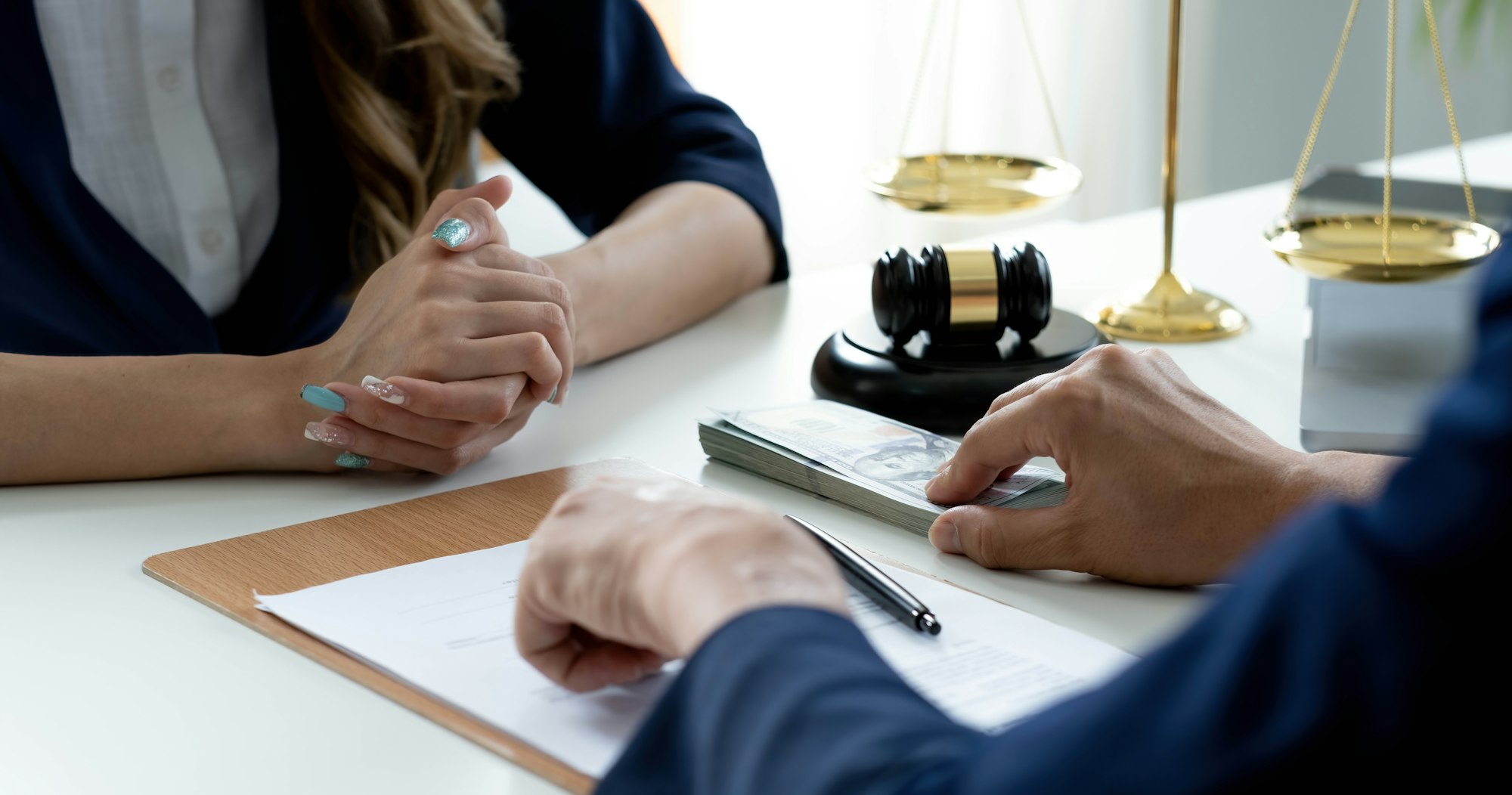 Close-up shot, A male client giving a house loan payment or mortgage fees to his female real estate